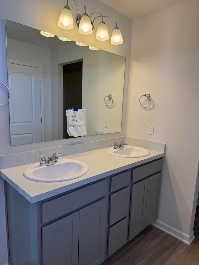 bathroom featuring hardwood / wood-style floors and vanity