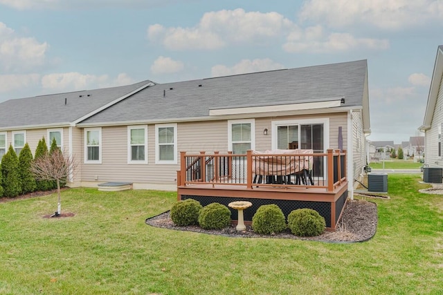 back of house with a yard, cooling unit, and a deck