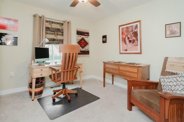 carpeted office with ceiling fan