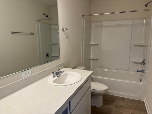 full bathroom featuring shower / bathtub combination, vanity, toilet, and wood finished floors