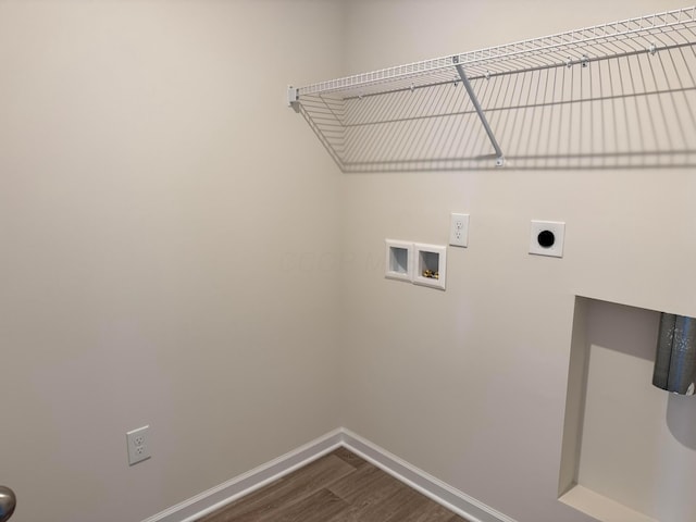 laundry room with laundry area, baseboards, dark wood-style flooring, hookup for a washing machine, and hookup for an electric dryer