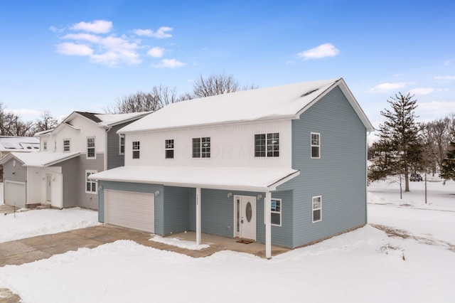 front of property with a garage