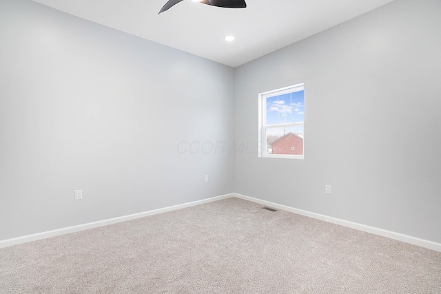 empty room featuring ceiling fan and carpet floors