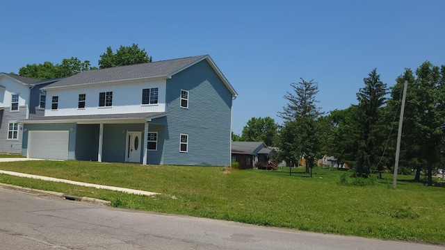 1532 Westmeadow Dr, Columbus, OH 43223 - view of front facade with an attached garage, a front lawn, driveway, and roof with shingles