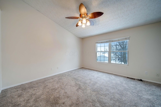 empty room with a textured ceiling, ceiling fan, and carpet flooring