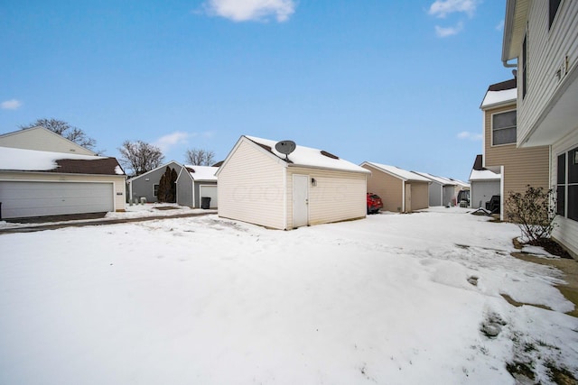 snowy yard with an outdoor structure