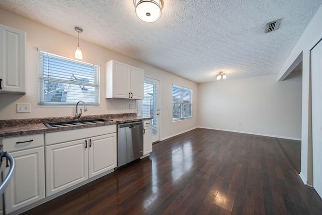 kitchen with sink, white cabinets, decorative light fixtures, and dishwasher