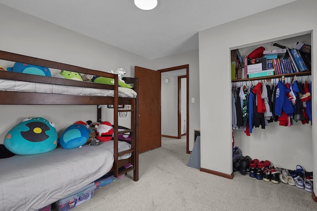 carpeted bedroom featuring a closet