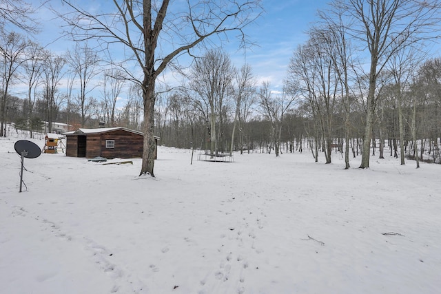 view of yard layered in snow