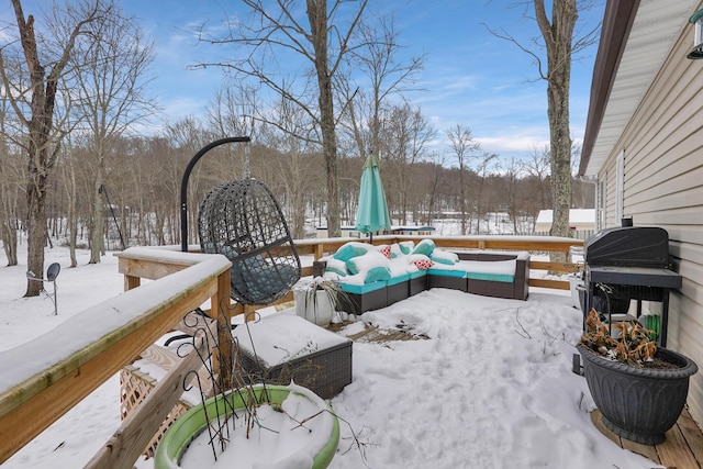 snow covered patio featuring an outdoor hangout area and a grill