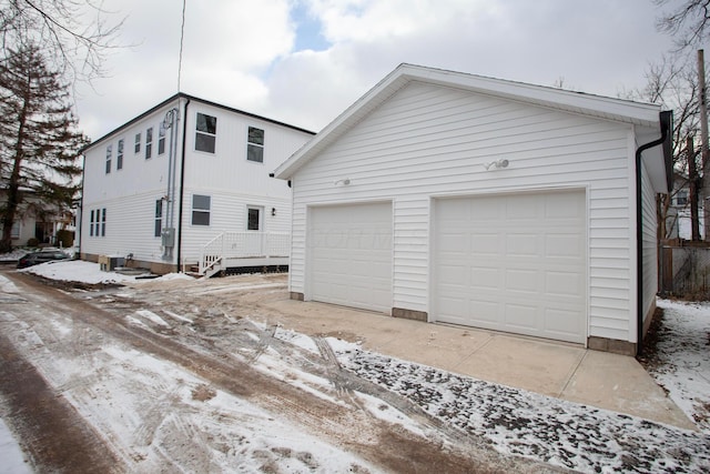 view of front of house featuring a garage and an outdoor structure