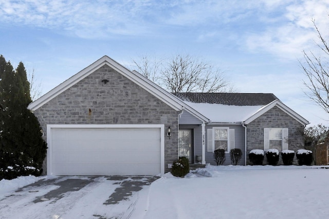 single story home featuring a garage