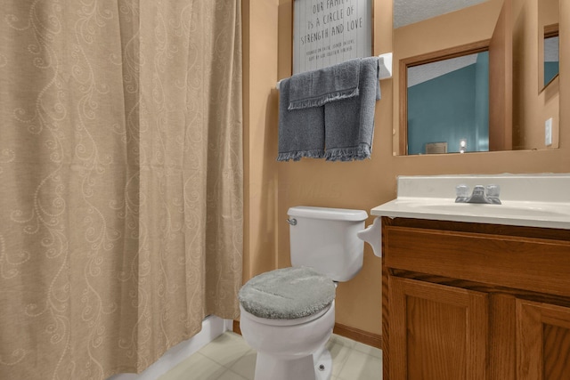 bathroom featuring vanity, toilet, a textured ceiling, and walk in shower