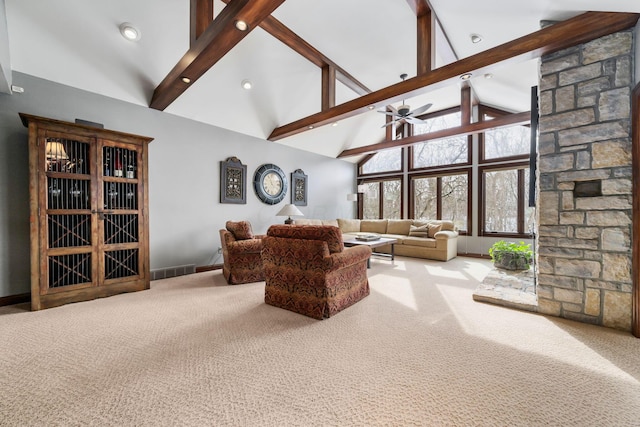 living room featuring high vaulted ceiling, beam ceiling, carpet flooring, and visible vents