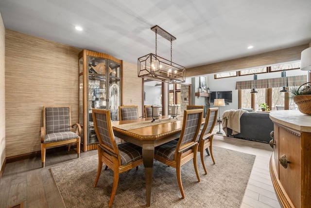 dining room with light wood-style floors and recessed lighting