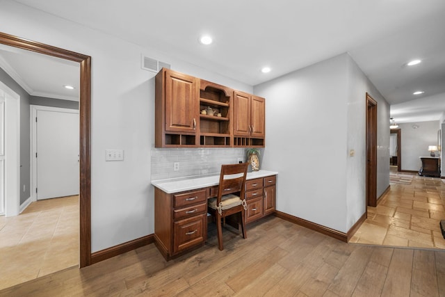 home office with recessed lighting, built in study area, and baseboards