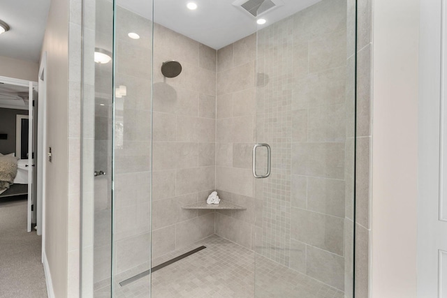 ensuite bathroom with recessed lighting, visible vents, a shower stall, ensuite bath, and baseboards