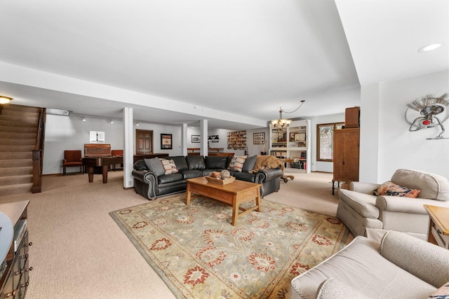 living area with light carpet, stairway, and a notable chandelier