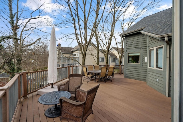 wooden terrace featuring outdoor dining space