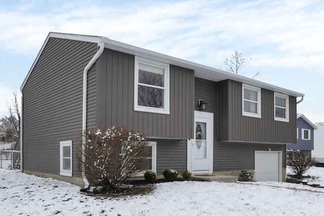 bi-level home featuring a garage