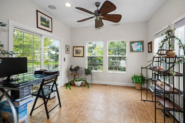 office space with ceiling fan and light tile patterned flooring