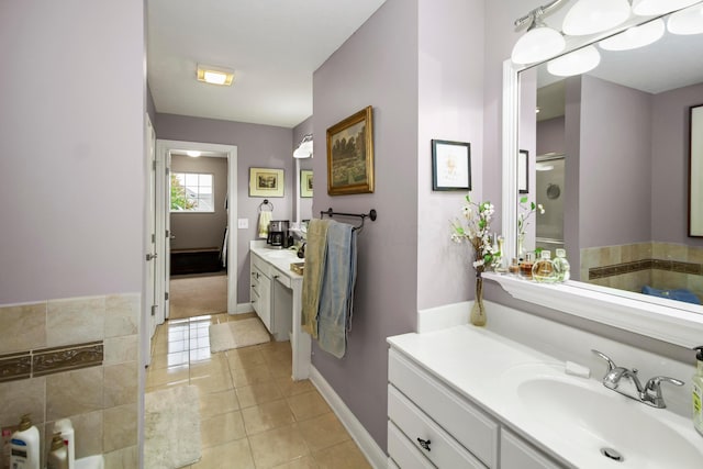 bathroom featuring tile patterned flooring and vanity