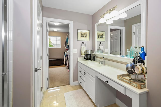 bathroom with tile patterned floors and vanity