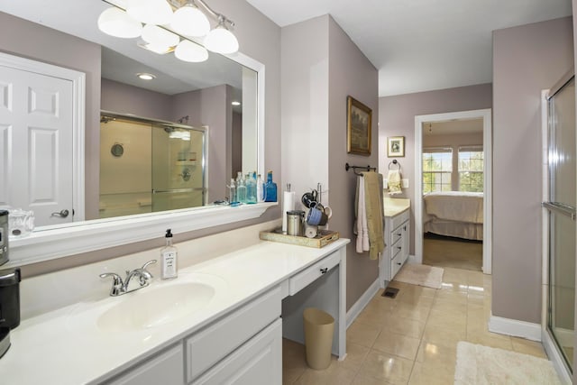 bathroom with tile patterned floors, vanity, and a shower with shower door