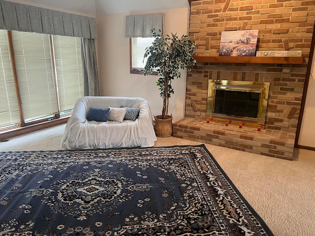 sitting room featuring carpet flooring and a brick fireplace