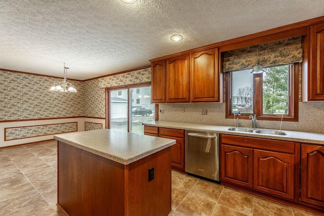 kitchen with sink, a notable chandelier, dishwasher, a kitchen island, and hanging light fixtures