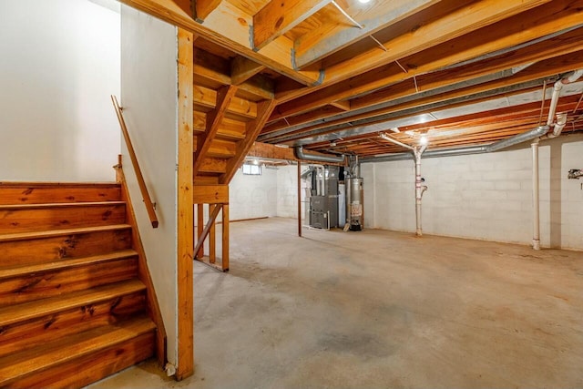 basement with gas water heater and heating unit