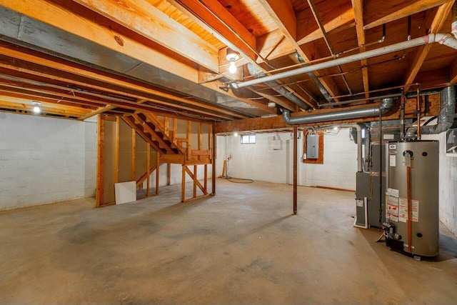 basement featuring gas water heater and electric panel