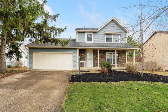 view of front property with a garage and a front lawn