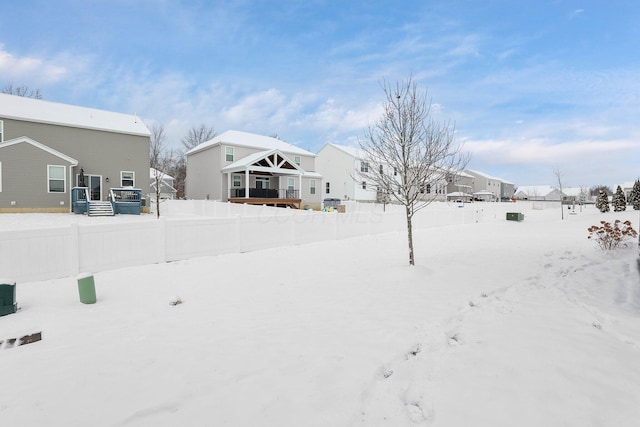 view of yard layered in snow