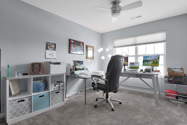 home office featuring ceiling fan and carpet