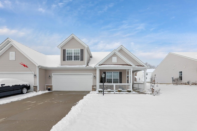 view of front of property featuring covered porch and a garage