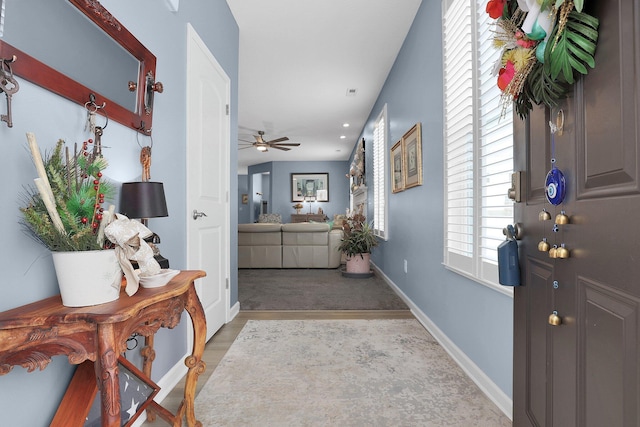 entrance foyer featuring light hardwood / wood-style flooring and ceiling fan