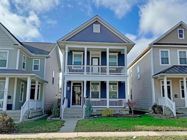 view of front of house with a balcony