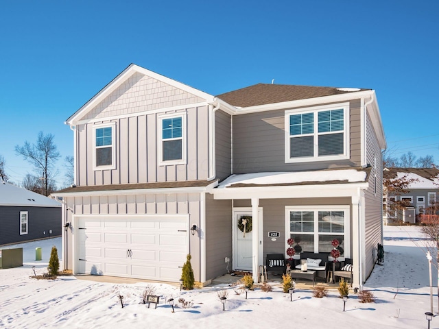 front facade featuring a garage and a porch