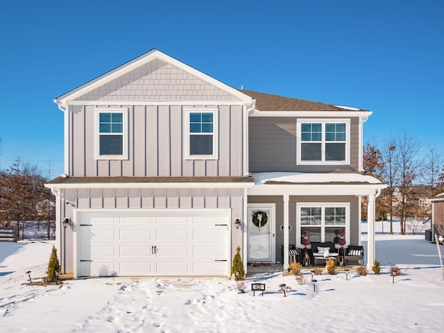 view of front property with a garage and covered porch