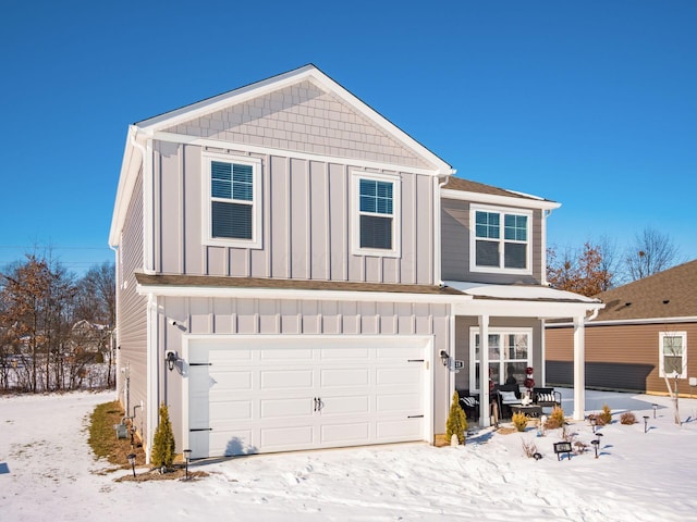 front of property featuring a garage and a porch