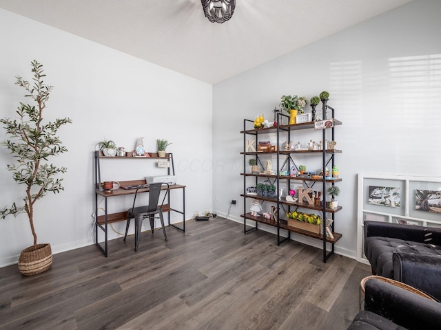 office area featuring dark wood-type flooring and lofted ceiling