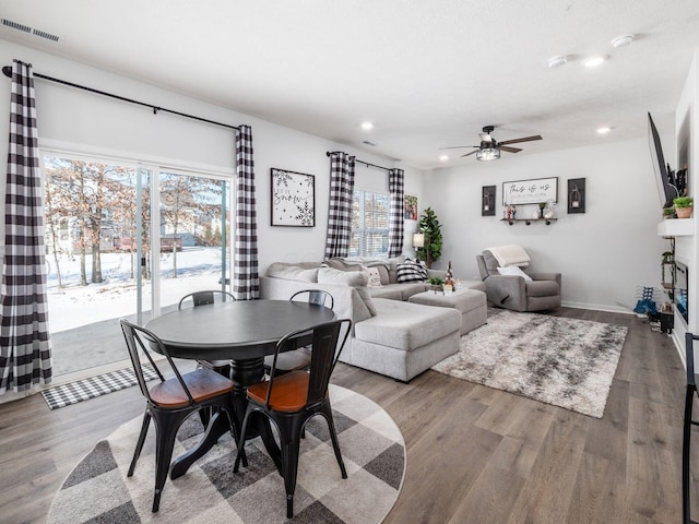 dining area featuring ceiling fan and wood-type flooring