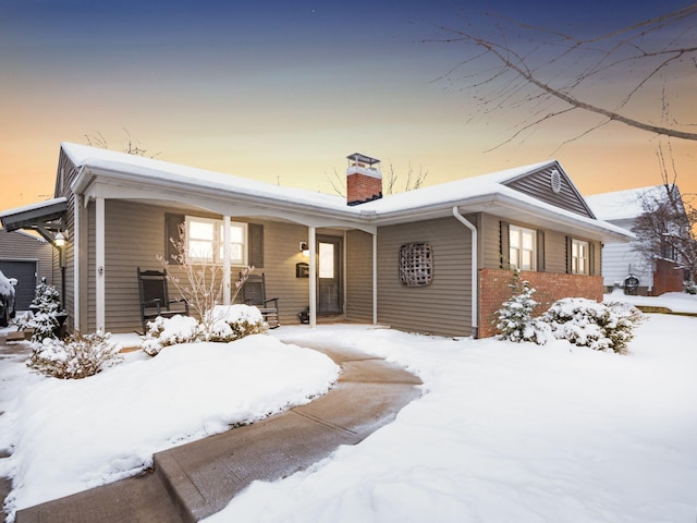 ranch-style home featuring a porch