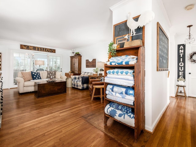 interior space featuring hardwood / wood-style floors and ornamental molding