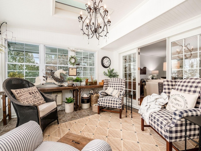 sunroom with an inviting chandelier