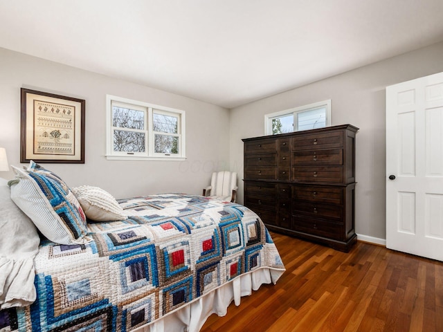 bedroom featuring dark hardwood / wood-style flooring