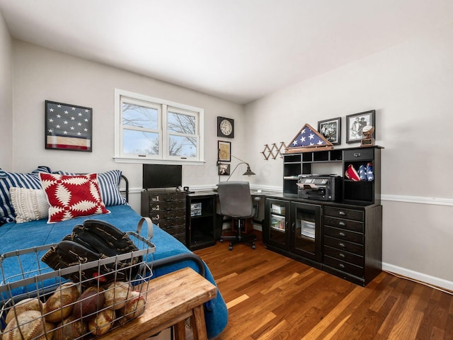 bedroom featuring dark hardwood / wood-style flooring