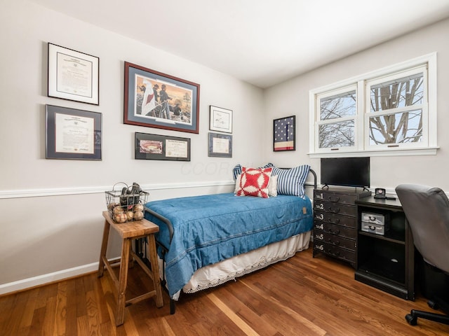 bedroom with hardwood / wood-style floors