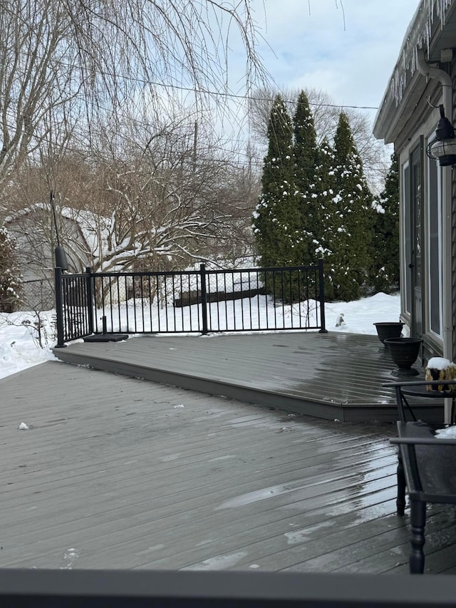 view of snow covered deck